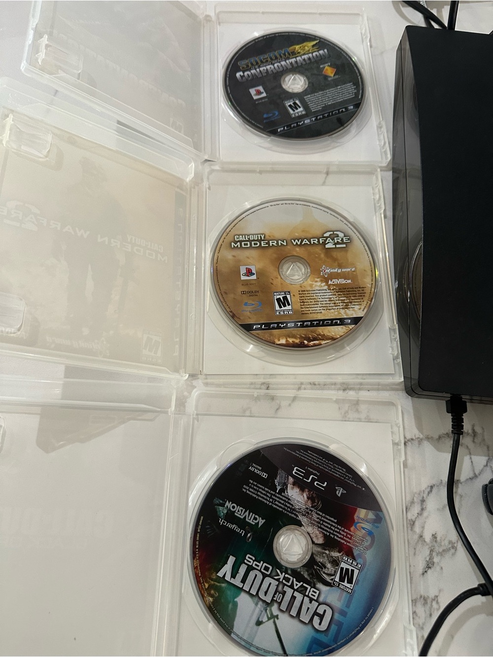 Sony Black PS3 Slim Console with Wired DualShock Controller and Game Discs - Picture 11 of 11